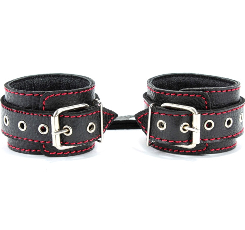 Кожаные наручники с металлическими шипами и контрастной строчкой фото 3